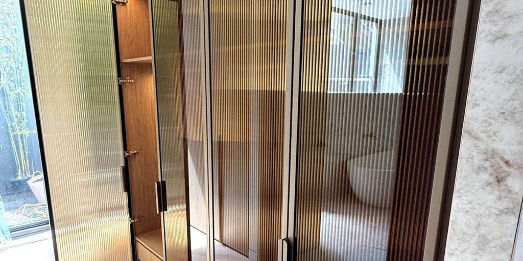 Glass doors with bronze reeded film installed